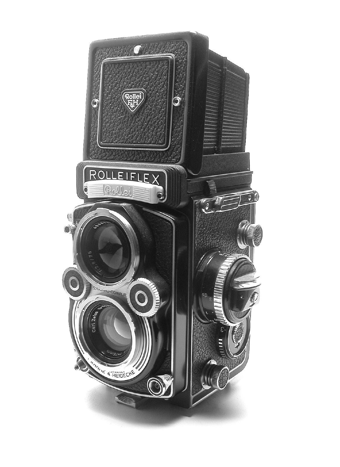 Rolleiflex 3.5F twin-lens reflex in black and white, seen from the front left, with a Carl Zeiss taking lens, a 75 mm f/2.8 viewing lens and the hood closed