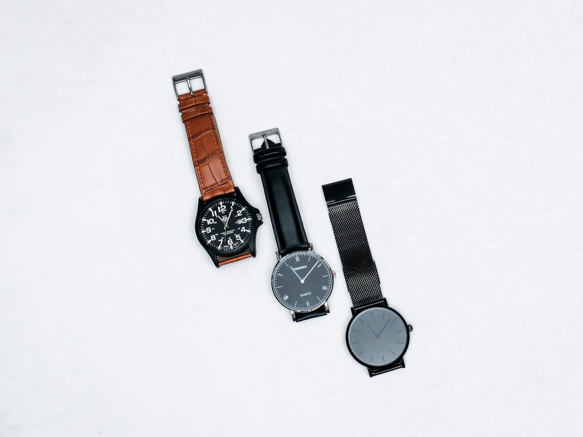Two analog watches side by side